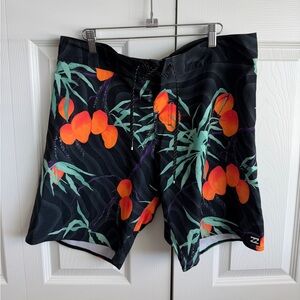 Billabong Black Board Shorts with Vibrant Orange Tropical Print